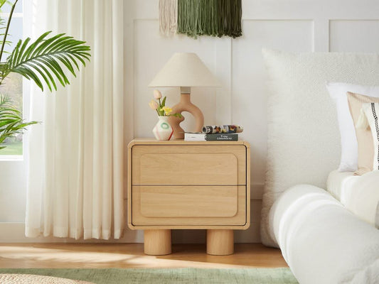 Lifely round bedside table styled beside a compact bedroom bed