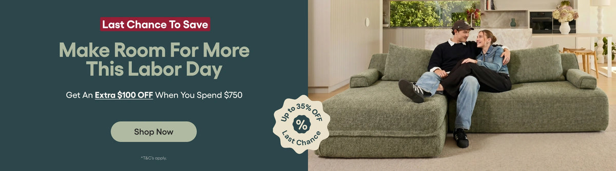 A promotional banner for a large chaise lounge sofa. The right side shows a man and woman sitting on the green textured chaise lounge in a living room setting.
