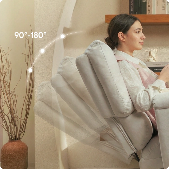 Woman using a massage chair with a neutral background